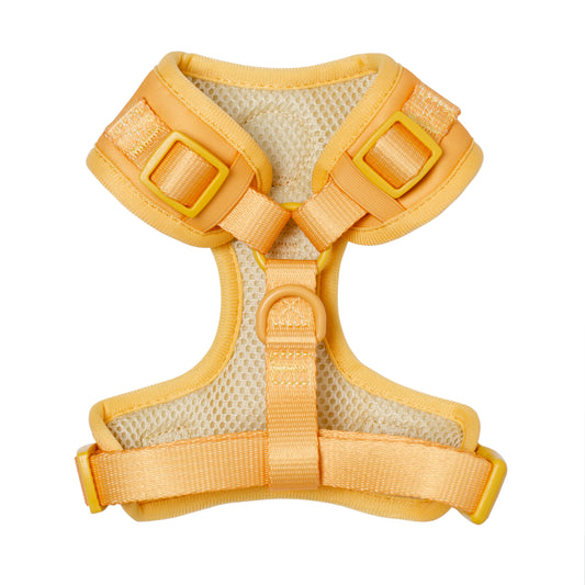 Adjustable fashion dog harness in soft butter tone with secure buckles and breathable material