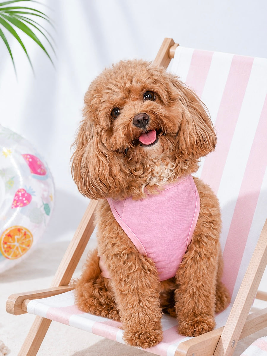 a small dog wearing the Happy Woof Ice Cream Date Cooling Vest in pink, designed with instant cooling fabric to help keep dogs cool during warm weather.
